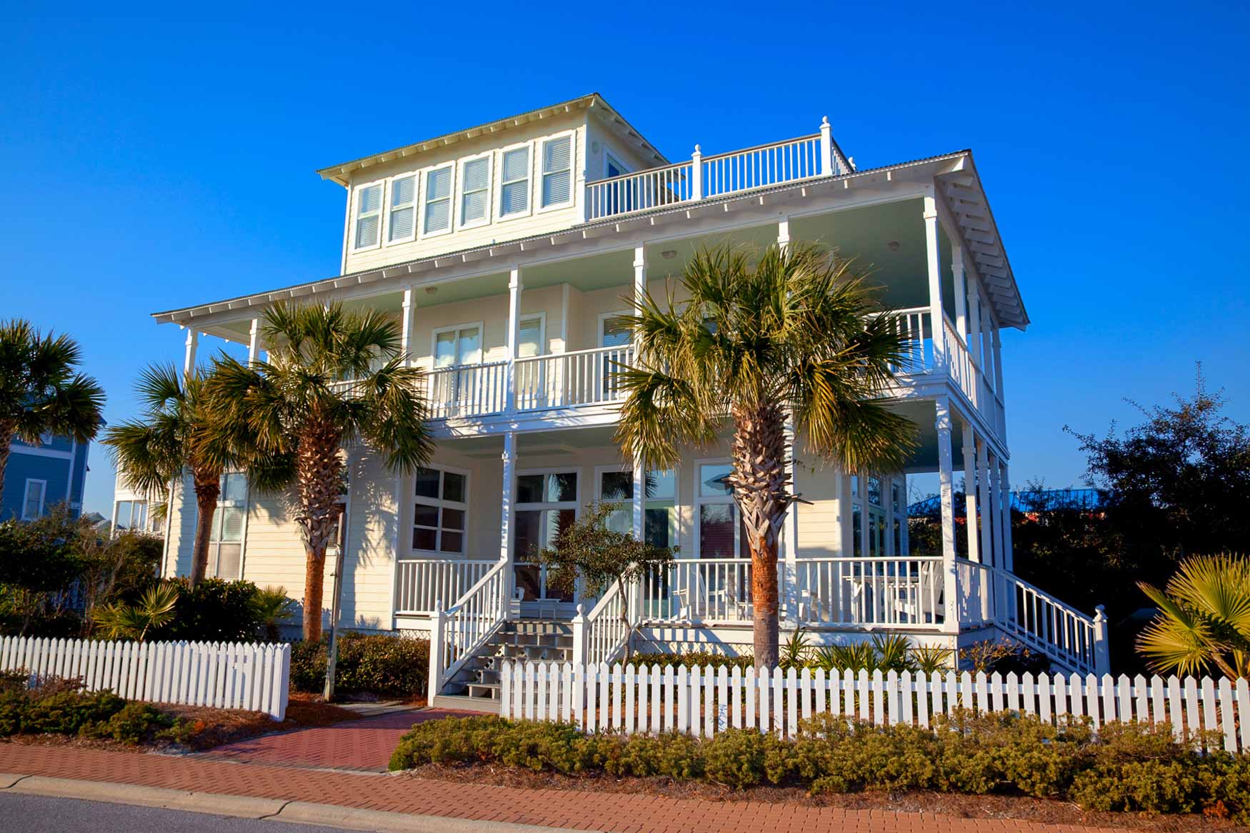 Road side view of two story beach home with 3rd floor tower room in Old Florida Beach on 30A.
